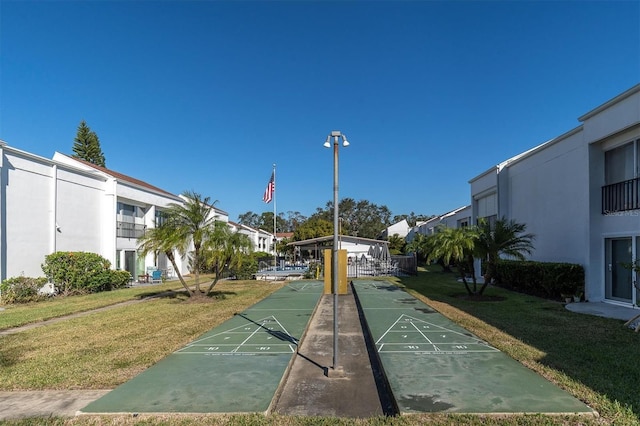 view of community featuring a yard