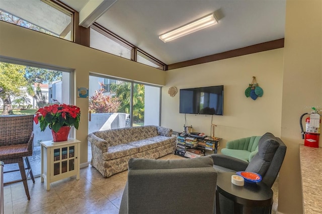 living room featuring light tile patterned floors and lofted ceiling with beams