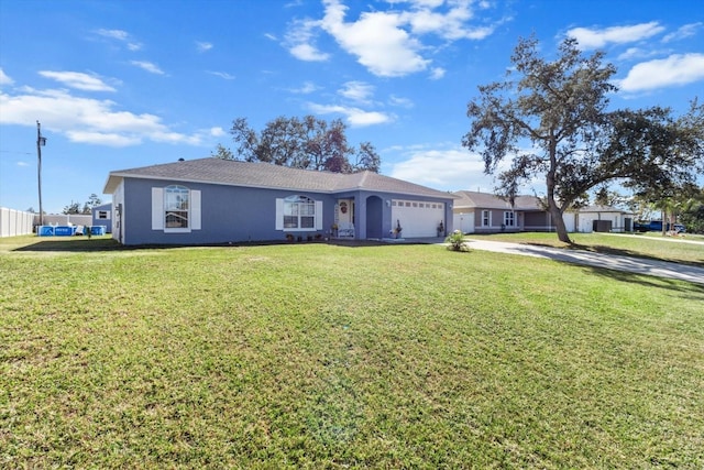 ranch-style home with a garage and a front lawn