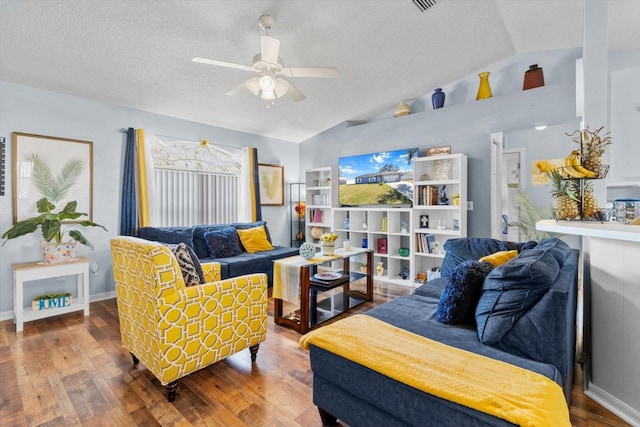 living room featuring ceiling fan, wood-type flooring, lofted ceiling, and a textured ceiling