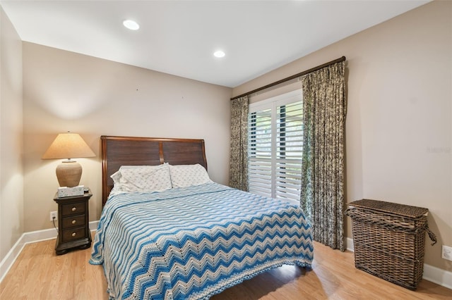 bedroom with hardwood / wood-style floors