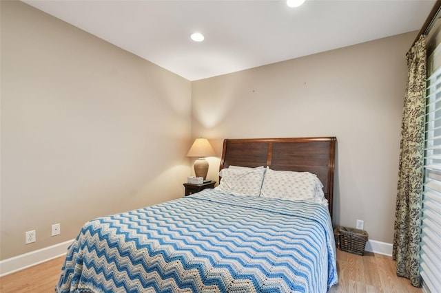 bedroom with light hardwood / wood-style flooring