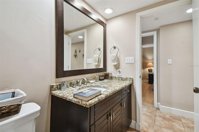 bathroom with vanity and toilet