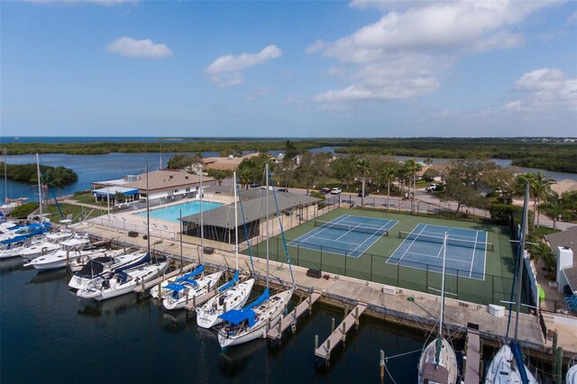 birds eye view of property with a water view