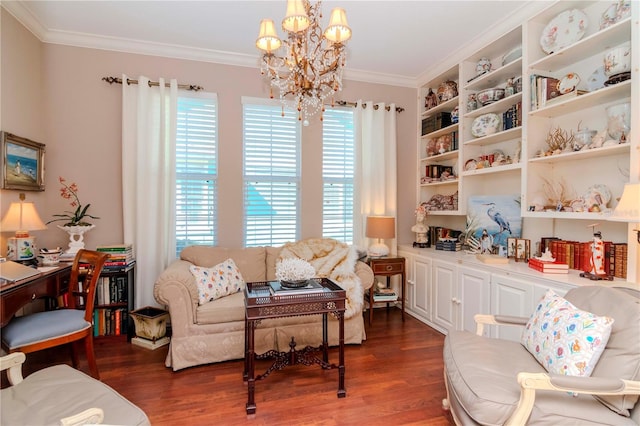 sitting room featuring a healthy amount of sunlight, ornamental molding, dark wood-type flooring, and a chandelier