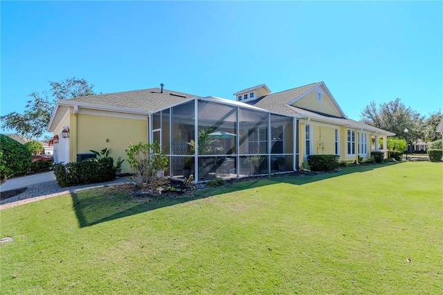 5314 Golden Isles Dr, Apollo Beach, FL 33572 - rear view of house featuring a yard, stucco siding, and a lanai