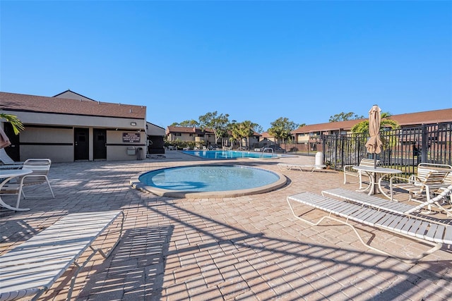 view of swimming pool with a patio area