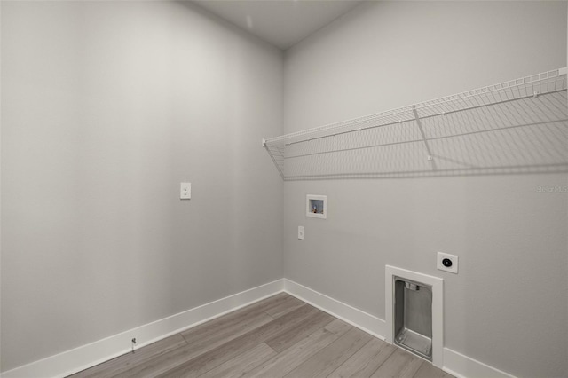 laundry area featuring washer hookup, hardwood / wood-style floors, and electric dryer hookup