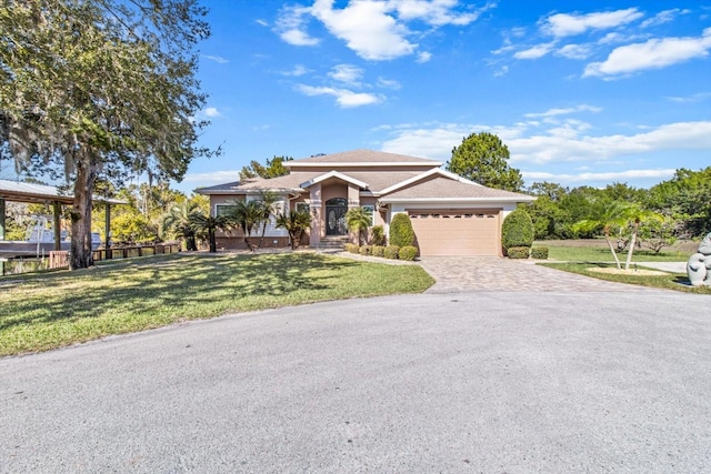 view of front of house featuring a front yard and a garage