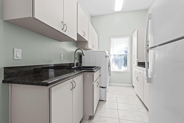 washroom with light tile patterned floors and sink