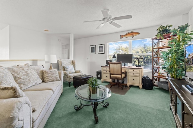 living room with a textured ceiling, carpet floors, and ceiling fan