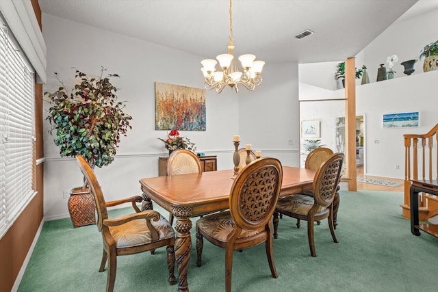 carpeted dining area with vaulted ceiling and an inviting chandelier