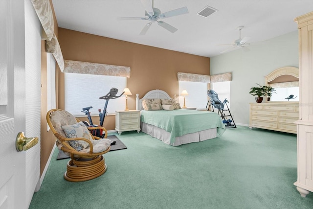 bedroom with ceiling fan, carpet floors, and vaulted ceiling