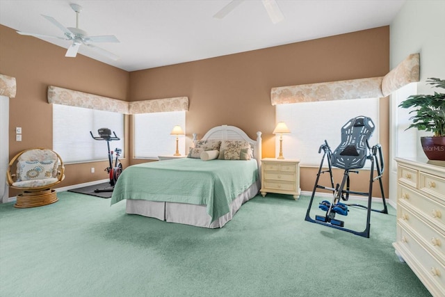 bedroom with carpet, ceiling fan, and multiple windows