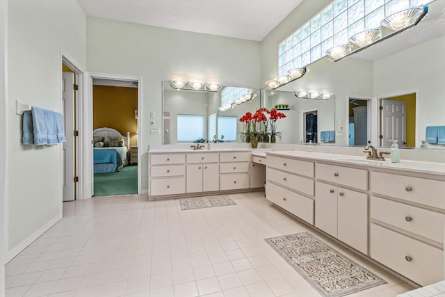 bathroom featuring tile patterned flooring and vanity