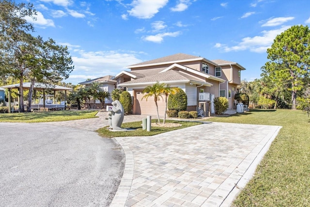 view of front facade with a front yard and a garage