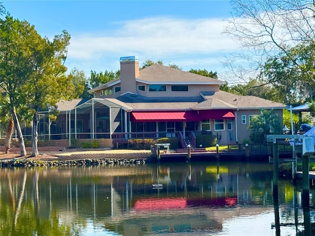 back of house featuring a water view