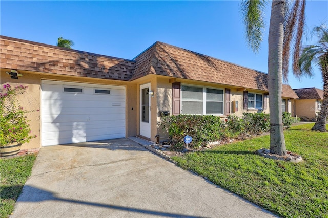 single story home with a front yard and a garage