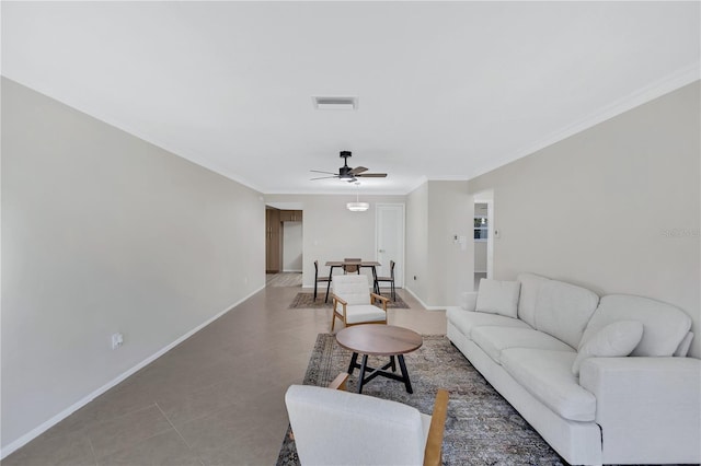 tiled living room with crown molding and ceiling fan