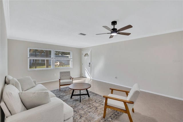 living room with ceiling fan, crown molding, and light tile patterned floors