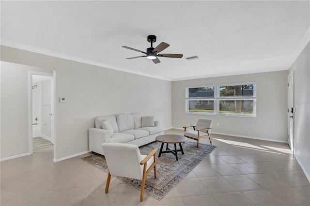 living room with crown molding, ceiling fan, and light tile patterned floors