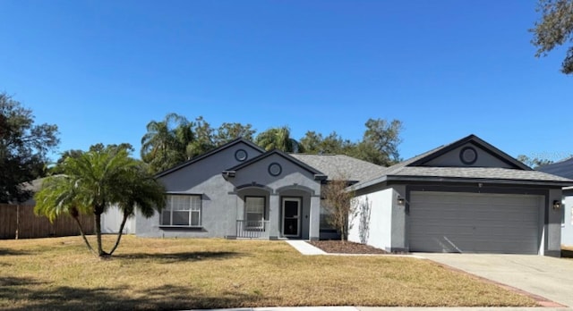 ranch-style home with a front lawn and a garage