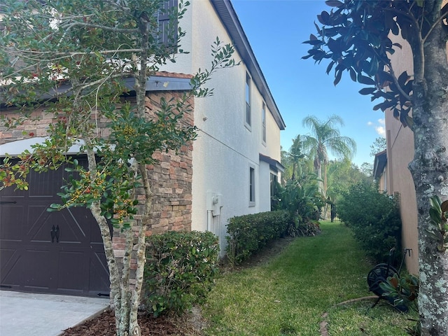 view of side of home featuring a yard