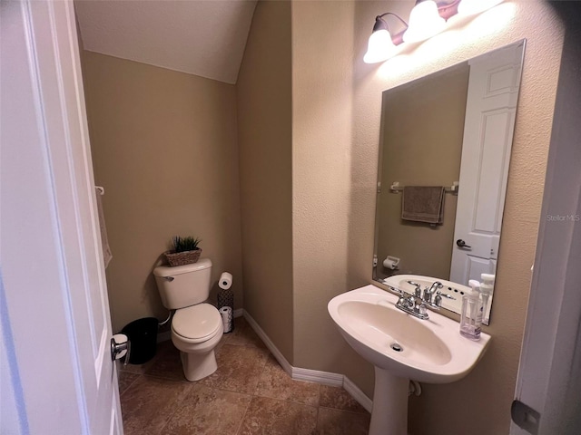 bathroom featuring tile patterned floors, toilet, and sink