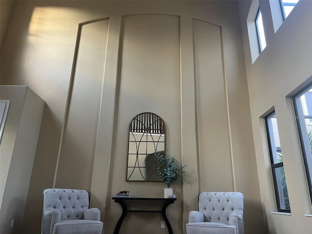 sitting room with a high ceiling