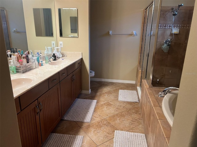 full bathroom featuring tile patterned flooring, vanity, separate shower and tub, and toilet