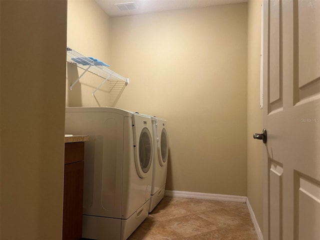 laundry area featuring independent washer and dryer