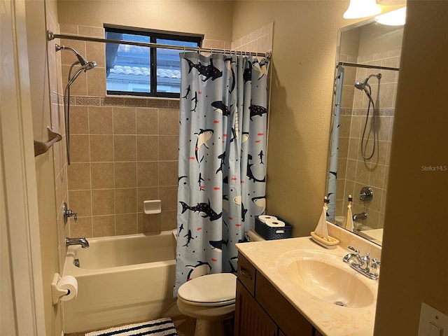 full bathroom featuring shower / bath combo with shower curtain, vanity, and toilet