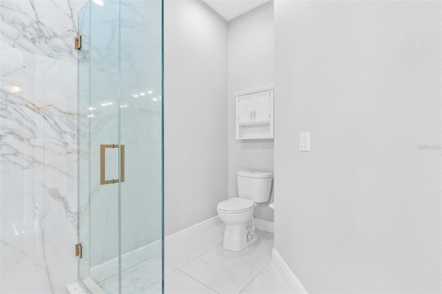 bathroom with toilet and a shower with shower door