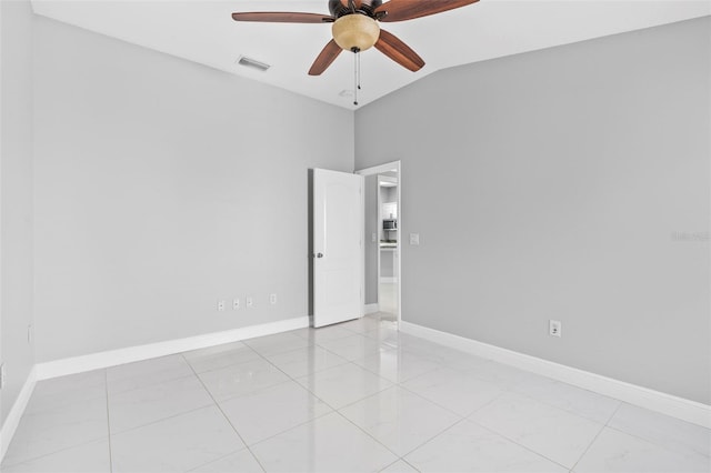 spare room featuring ceiling fan and lofted ceiling