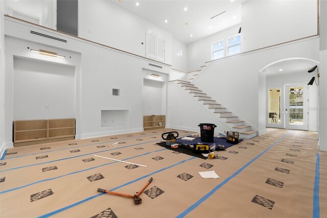 entrance foyer with a towering ceiling