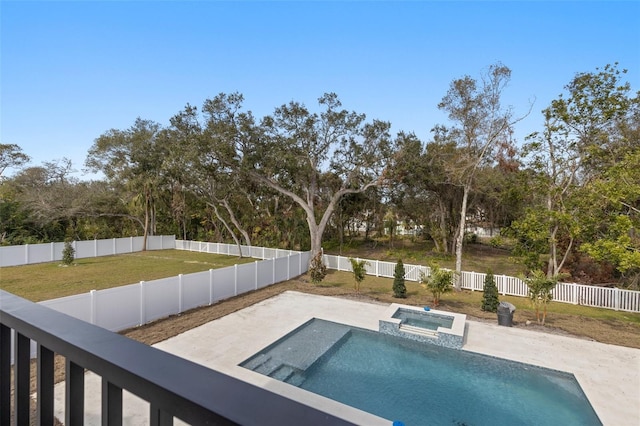 view of pool with a yard, a patio area, and an in ground hot tub