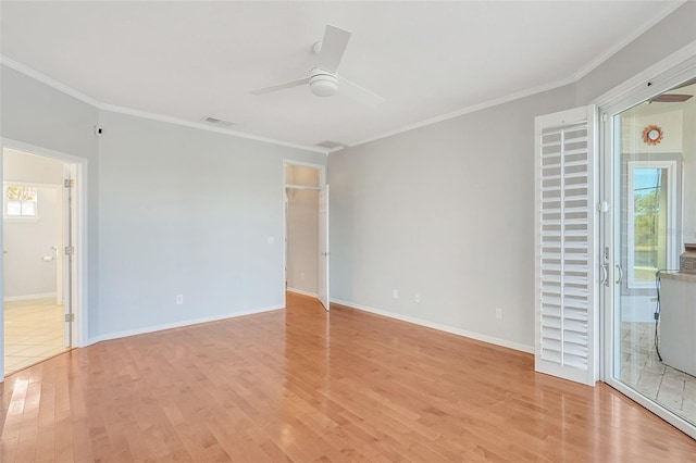 unfurnished room with ceiling fan, light hardwood / wood-style floors, and ornamental molding