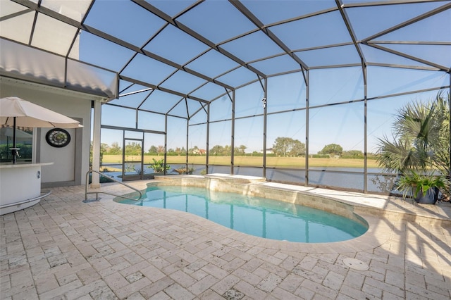 view of swimming pool with a patio and a lanai