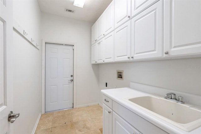 laundry area featuring sink, cabinets, and washer hookup