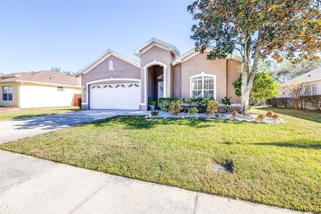 view of front of home with a garage and a front yard