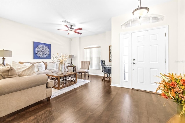 living room featuring dark hardwood / wood-style floors and ceiling fan