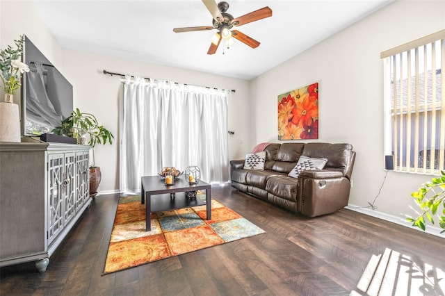 living room featuring ceiling fan and dark hardwood / wood-style flooring