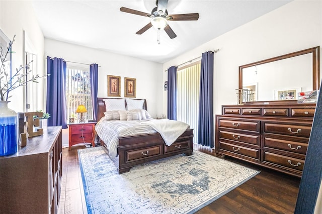 bedroom with dark wood-type flooring and ceiling fan