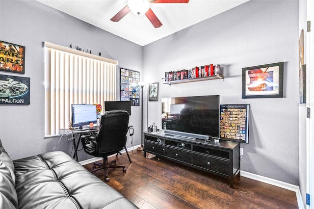 home office with ceiling fan and dark hardwood / wood-style flooring