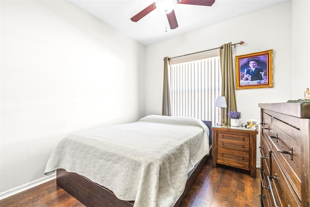 bedroom featuring dark hardwood / wood-style flooring and ceiling fan