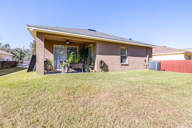 back of house with a yard, central AC, ceiling fan, and a patio area