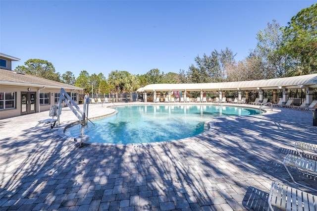 view of swimming pool featuring a patio area