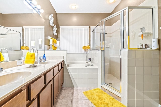 bathroom with vanity, tile patterned floors, and independent shower and bath