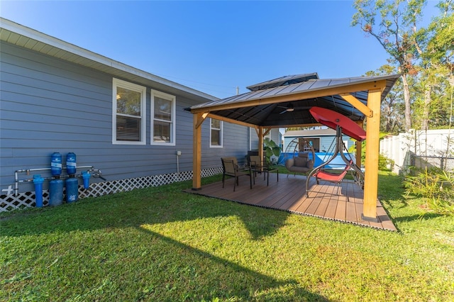 exterior space featuring a gazebo and a deck