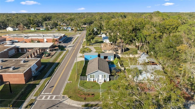birds eye view of property with a residential view and a view of trees
